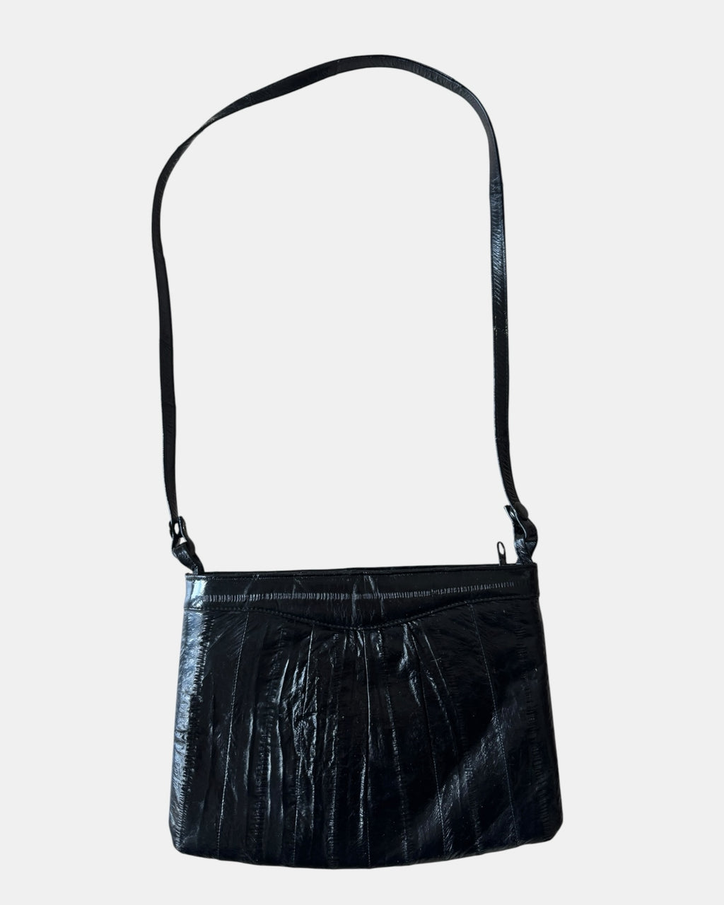 Highway Robbery Vintage black genuine eel skin crossbody bag with a glossy texture and adjustable shoulder strap.
