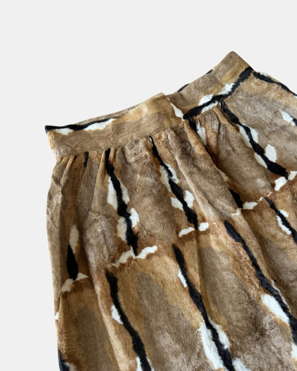 Highway Robbery Vintage faux fur midi skirt in a brown, cream, and black abstract pattern with a soft texture.
