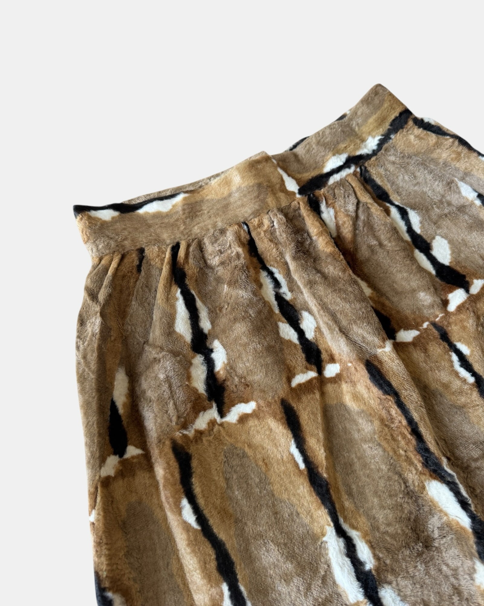 Highway Robbery Vintage faux fur midi skirt in a brown, cream, and black abstract pattern with a soft texture.